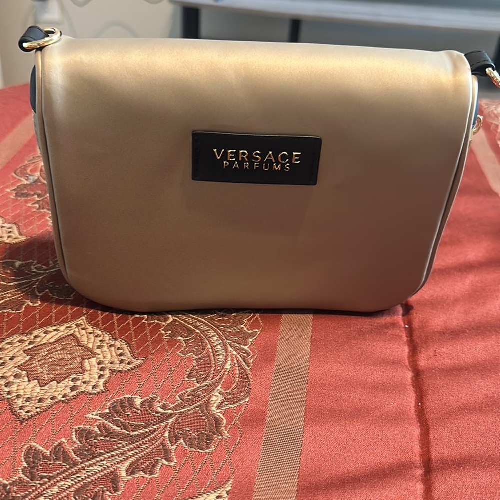 Versace Parfums shiny gold bag/pouch